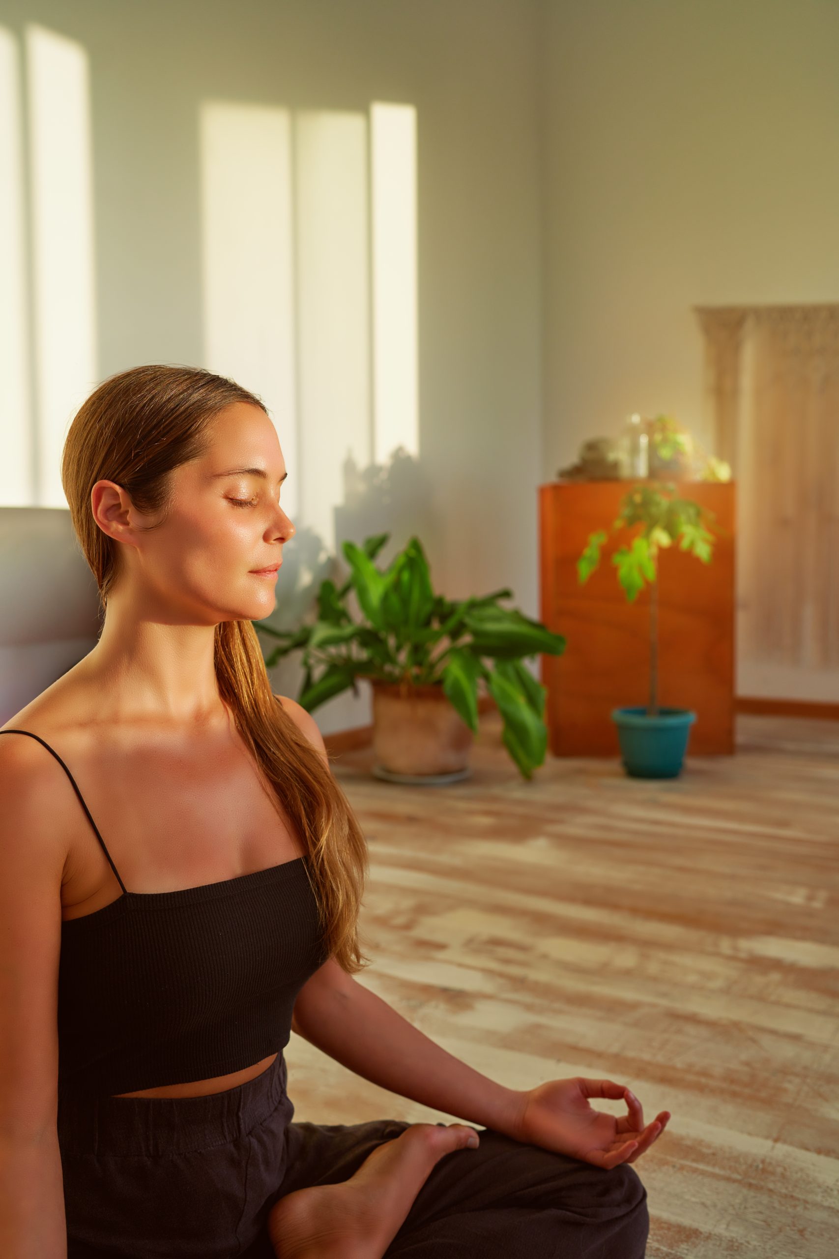 woman with eyes closed sitting still